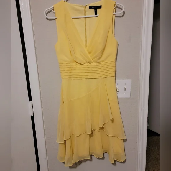 Yellow cocktail BCBG dress worn once. BEAUTIFUL ruffled front, zip up back. Yellow cocktail BCBG dress worn once. BEAUTIFUL ruffled front, zip up back.